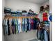 Spacious walk-in closet with ample shelving and hanging space at 3198 Sailing Pier Ave, Winter Garden, FL 34787