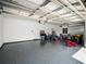 Spacious garage with epoxy flooring and plenty of storage space at 3198 Sailing Pier Ave, Winter Garden, FL 34787