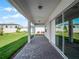 Covered patio with pavers and sliding glass doors leading to the backyard at 3198 Sailing Pier Ave, Winter Garden, FL 34787