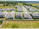 Aerial view of a community with multiple houses and green spaces at 3198 Sailing Pier Ave, Winter Garden, FL 34787