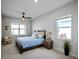 Secondary bedroom with a queen-size bed and natural light at 3198 Sailing Pier Ave, Winter Garden, FL 34787