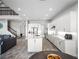 Modern kitchen with white cabinets, quartz countertops, and island at 3198 Sailing Pier Ave, Winter Garden, FL 34787