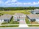 Aerial view of a new home community with lake access at 3198 Sailing Pier Ave, Winter Garden, FL 34787