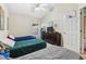 Bedroom featuring three beds, a dresser, and a basketball hoop at 808 Oxford Dr, Davenport, FL 33897