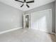 Bedroom with tile floors and a ceiling fan at 1628 S Grove St, Eustis, FL 32726
