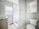 Updated bathroom with walk-in shower and granite vanity at 1628 S Grove St, Eustis, FL 32726