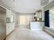 Open concept kitchen with stainless steel appliances and island at 1628 S Grove St, Eustis, FL 32726