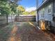 Backyard with a fence, grass, and AC unit at 1628 S Grove St, Eustis, FL 32726