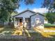 Gray house with front porch and yard at 1628 S Grove St, Eustis, FL 32726