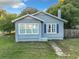Blue house with white trim and blue shutters at 1628 S Grove St, Eustis, FL 32726