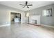 Living room with ceiling fan and brick fireplace at 1628 S Grove St, Eustis, FL 32726