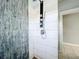 Walk-in shower with modern fixtures and tile surround at 1628 S Grove St, Eustis, FL 32726