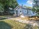Gray house with a fenced yard and mature trees at 1628 S Grove St, Eustis, FL 32726