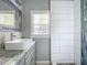 Modern bathroom with a large vanity and walk-in shower at 1628 S Grove St, Eustis, FL 32726