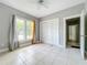 Spacious bedroom with tile floors and two closets at 1628 S Grove St, Eustis, FL 32726