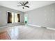 Bright living room featuring tile floors and a ceiling fan at 1628 S Grove St, Eustis, FL 32726