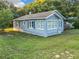 Charming blue house with large windows and yard at 1628 S Grove St, Eustis, FL 32726