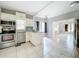 Updated kitchen with white cabinets, granite counters, and stainless steel appliances at 1628 S Grove St, Eustis, FL 32726