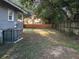 Large backyard with a fence and mature trees at 1628 S Grove St, Eustis, FL 32726