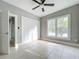 Spacious bedroom with tile floors and ceiling fan at 1628 S Grove St, Eustis, FL 32726