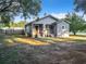 Gray house with back porch and large yard at 1628 S Grove St, Eustis, FL 32726