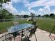 Backyard with patio furniture, playground, and lake view at 714 Hacienda Cir, Kissimmee, FL 34741