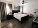 Spacious Primary bedroom with large bed, nightstands, and wood-look floors at 714 Hacienda Cir, Kissimmee, FL 34741