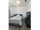 Bright bedroom with a queen-size bed and large TV at 714 Hacienda Cir, Kissimmee, FL 34741