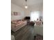 Charming bedroom with daybed, TV, and decorative elements at 714 Hacienda Cir, Kissimmee, FL 34741