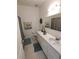 Bathroom with single vanity and shower/tub combo at 714 Hacienda Cir, Kissimmee, FL 34741
