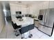 Kitchen with white cabinets and stainless steel appliances at 714 Hacienda Cir, Kissimmee, FL 34741