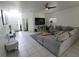 Large living room with sectional sofa and tile floors at 714 Hacienda Cir, Kissimmee, FL 34741