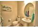 Small half bathroom with pedestal sink and neutral color scheme at 1687 Kona Ln, Davenport, FL 33897