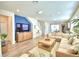 Spacious living room with large sectional sofa and wood floors at 1687 Kona Ln, Davenport, FL 33897