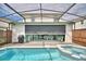 Inviting pool and spa with covered patio; perfect for outdoor entertaining at 1687 Kona Ln, Davenport, FL 33897