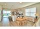 Modern kitchen with island, breakfast bar and view of patio at 1687 Kona Ln, Davenport, FL 33897