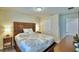 Bedroom with ensuite and nightstands at 1687 Kona Ln, Davenport, FL 33897