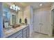 Double vanity bathroom with granite countertop at 1687 Kona Ln, Davenport, FL 33897