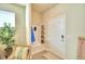 Bright entryway with built-in storage and bench at 1687 Kona Ln, Davenport, FL 33897