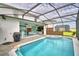 Large pool with spa and covered patio with seating area at 1687 Kona Ln, Davenport, FL 33897