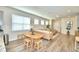 Bright living room with hardwood floors, large windows, and comfortable seating at 1687 Kona Ln, Davenport, FL 33897