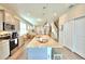 Modern kitchen with a large island, stainless steel appliances and pendant lighting at 1687 Kona Ln, Davenport, FL 33897
