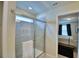 Modern bathroom with a glass shower door and view of bedroom at 1687 Kona Ln, Davenport, FL 33897