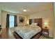 Bedroom with large window and wood dresser at 1687 Kona Ln, Davenport, FL 33897