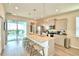 Modern kitchen featuring stainless steel appliances and an island with seating at 1687 Kona Ln, Davenport, FL 33897
