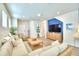 Spacious living room with large sectional sofa and wood floors at 1687 Kona Ln, Davenport, FL 33897