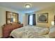 Bedroom with dresser and window coverings at 1687 Kona Ln, Davenport, FL 33897