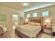 Main bedroom with large bed and ensuite bathroom at 1687 Kona Ln, Davenport, FL 33897