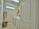 Laundry room with washer, dryer, and shelving at 1687 Kona Ln, Davenport, FL 33897