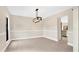 Spacious dining area with kitchen access and large windows at 7972 Snowberry Cir, Orlando, FL 32819